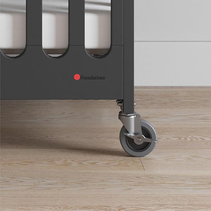 Foundations Boutique Folding Mini Baby Crib - Compact, Portable, Wooden Hotel Crib, Foldable Compact Cribs for Baby & Toddlers - Includes 3" Foam Mattress - Ebony