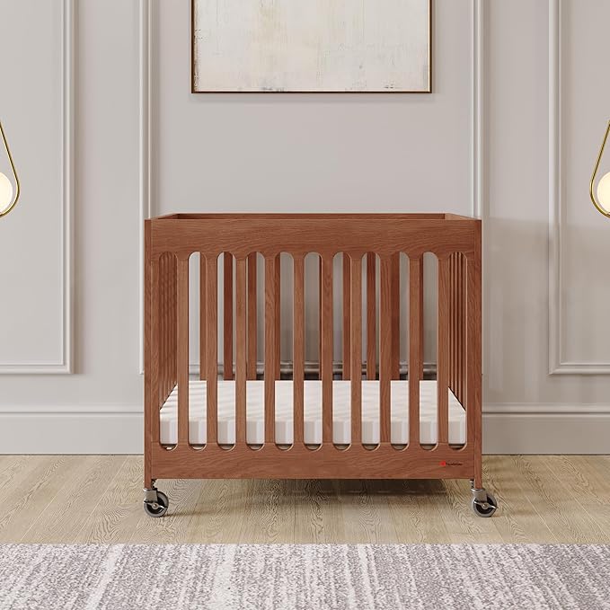 Foundations Boutique Folding Mini Baby Crib - Compact, Portable, Wooden Hotel Crib, Foldable Compact Cribs for Baby & Toddlers - Includes 3" Foam Mattress - Cherry